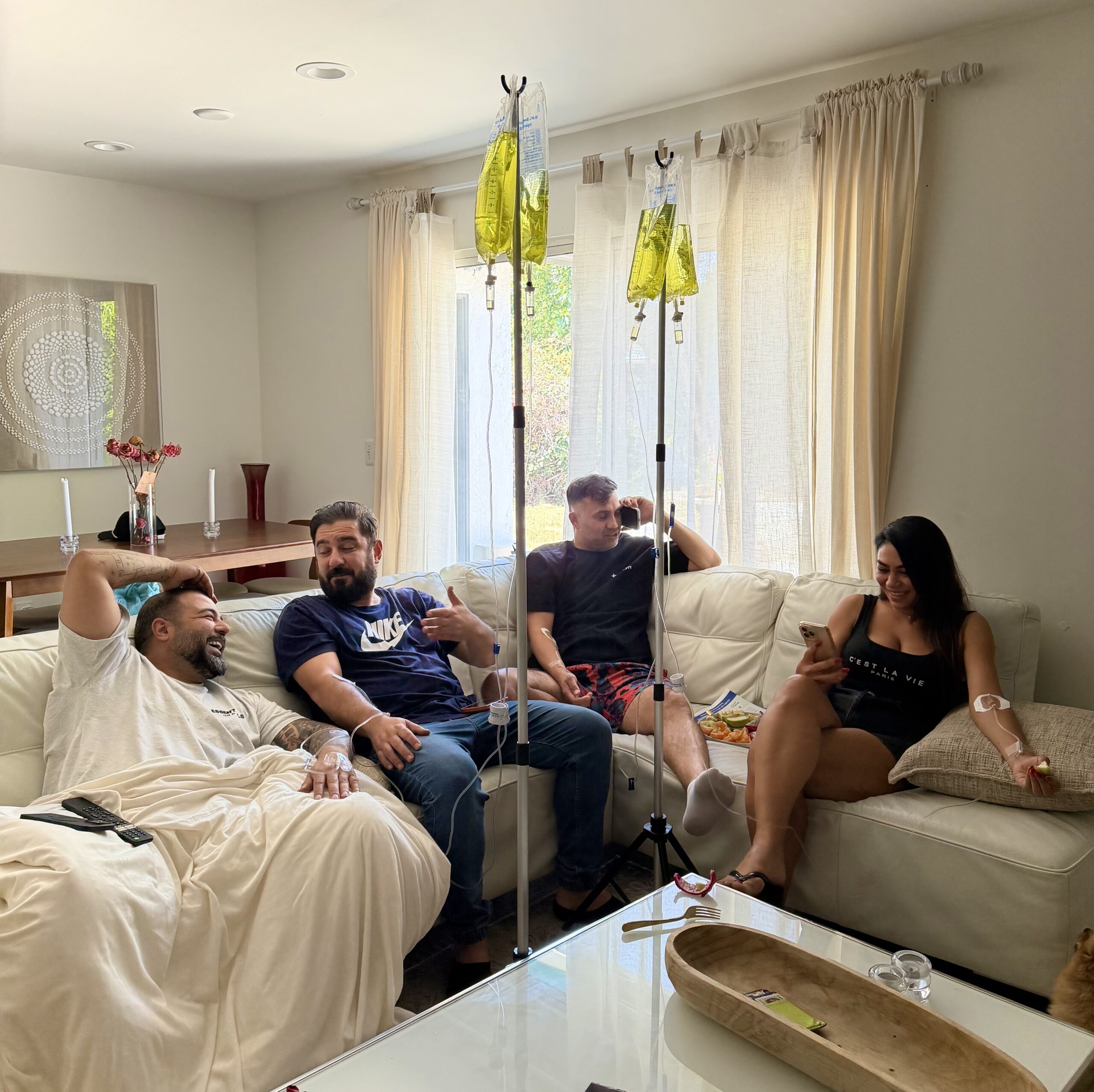 Clients relaxing and receiving IV drip therapy